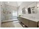 Elegant bathroom with double vanity, a walk-in shower and shiplap accent wall at 112 Pebblebrooke Run, Canton, GA 30115