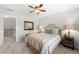 Charming bedroom with a ceiling fan, carpet, stylish furnishings, and natural light from two windows at 112 Pebblebrooke Run, Canton, GA 30115