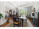 Bright dining room with hardwood floors, chandelier, and plenty of natural light at 112 Pebblebrooke Run, Canton, GA 30115