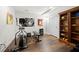 Bright home gym with cardio equipment and guitar wall art at 112 Pebblebrooke Run, Canton, GA 30115