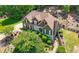 Aerial view of a two-story home featuring manicured landscaping and a well-maintained lawn at 112 Pebblebrooke Run, Canton, GA 30115