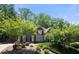 Well-maintained home exterior with lush landscaping, creating a picturesque and inviting curb appeal at 112 Pebblebrooke Run, Canton, GA 30115