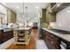 Open kitchen with island, stainless appliances and granite countertops at 112 Pebblebrooke Run, Canton, GA 30115