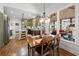 Lovely eat-in kitchen with stainless appliances, island, and a view to the screened porch at 112 Pebblebrooke Run, Canton, GA 30115