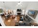 Spacious living room with a stone fireplace and large windows, creating a welcoming atmosphere at 112 Pebblebrooke Run, Canton, GA 30115