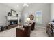 Cozy sitting area in the main bedroom with fireplace and plush seating at 112 Pebblebrooke Run, Canton, GA 30115
