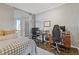 Bedroom featuring two desks and access to the balcony offering natural light and outside views at 130 26Th St # 706, Atlanta, GA 30309