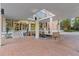 Elegant building entrance with brick pavers, benches, and a covered walkway at 130 26Th St # 706, Atlanta, GA 30309