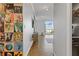 Apartment hallway with unique record album art leading to a living area with great light at 130 26Th St # 706, Atlanta, GA 30309
