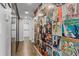 Hallway featuring a unique record-covered wall and modern mirror closet doors and wood parquet floor at 130 26Th St # 706, Atlanta, GA 30309