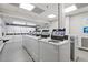 Clean and bright laundry room with multiple washing machines for resident convenience at 130 26Th St # 706, Atlanta, GA 30309