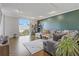 Inviting living room with hardwood floors, a comfortable gray couch, and a bright window view at 130 26Th St # 706, Atlanta, GA 30309