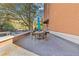 Outdoor patio with a dining area and views of the building and surrounding landscape at 130 26Th St # 706, Atlanta, GA 30309