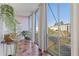 Bright sunroom with floor-to-ceiling windows offering beautiful views and tiled floor, perfect for relaxing and enjoying the scenery at 130 26Th St # 706, Atlanta, GA 30309