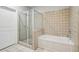 Modern bathroom with separate shower and bathtub, plus tiled walls at 238 Walker # 39, Atlanta, GA 30313