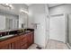 Bright bathroom featuring double vanity with dark countertops and a glass shower at 238 Walker # 39, Atlanta, GA 30313