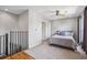 Upstairs bedroom with staircase access, modern ceiling fan, and neutral decor at 238 Walker # 39, Atlanta, GA 30313