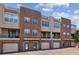 Exterior view of brick townhomes with attached garages and private balconies at 238 Walker # 39, Atlanta, GA 30313