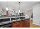 Modern kitchen featuring a black countertop, stainless steel sink, and a view to the living room at 238 Walker # 39, Atlanta, GA 30313
