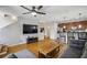 Open concept living room with kitchen, ceiling fan, hardwood floors, and stairs to upper level at 238 Walker # 39, Atlanta, GA 30313