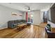 Spacious living room with hardwood floors, balcony access, and a comfortable couch for relaxation at 238 Walker # 39, Atlanta, GA 30313