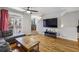 Cozy living room with hardwood floors, open layout, walk-out to balcony, and stairway to another level at 238 Walker # 39, Atlanta, GA 30313