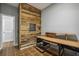 Dedicated office space with desk, shelving, and a reclaimed wood accent wall for a unique touch at 238 Walker # 39, Atlanta, GA 30313