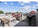 Enjoy city views from this rooftop deck with wooden floors, dining table, and space for entertaining at 238 Walker # 39, Atlanta, GA 30313