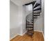 Stylish black spiral staircase connecting multiple levels and hardwood flooring at 238 Walker # 39, Atlanta, GA 30313