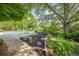 Lush backyard featuring a sparkling pool and beautifully landscaped areas for relaxation and enjoyment at 4891 Tarry Post Ln, Suwanee, GA 30024