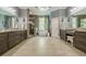 Elegant bathroom featuring double vanities, a soaking tub, and a walk-in shower at 4891 Tarry Post Ln, Suwanee, GA 30024