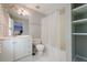 Bathroom featuring white cabinets, a tub, a toilet, and an ample sized vanity at 4891 Tarry Post Ln, Suwanee, GA 30024