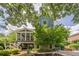 View of the rear of the house, pool area, patio, and multi-level terrace at 4891 Tarry Post Ln, Suwanee, GA 30024