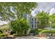 Beautiful two-story home with brick and siding, backyard patio, and lush landscaping at 4891 Tarry Post Ln, Suwanee, GA 30024
