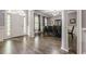 Elegant foyer with hardwood floors, a view of the dining room, and a bright, welcoming entrance at 4891 Tarry Post Ln, Suwanee, GA 30024