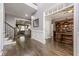 Welcoming foyer showcasing hardwood floors, elegant trim, and an open view into the living room and office at 4891 Tarry Post Ln, Suwanee, GA 30024