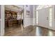Inviting foyer featuring hardwood floors, an office view, and a bright, arched front door at 4891 Tarry Post Ln, Suwanee, GA 30024