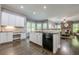 Spacious kitchen with white cabinets, stainless appliances, and an open layout at 4891 Tarry Post Ln, Suwanee, GA 30024