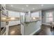 Bright kitchen with white cabinets, stainless steel appliances, and dark countertops at 4891 Tarry Post Ln, Suwanee, GA 30024