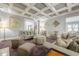 Spacious living room featuring a coffered ceiling, neutral color palette, and comfortable seating at 4891 Tarry Post Ln, Suwanee, GA 30024