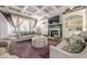 Inviting living room with coffered ceiling, fireplace, and comfortable seating arrangements at 4891 Tarry Post Ln, Suwanee, GA 30024