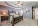 This is a bedroom with lavender walls, a decorative bed frame, and a ceiling fan with integrated lighting at 4891 Tarry Post Ln, Suwanee, GA 30024