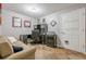 Bright office space features a built-in desk, tiled floors, and a nearby sofa at 4891 Tarry Post Ln, Suwanee, GA 30024