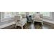 Cozy sitting area with two armchairs, a side table, and natural light from the windows at 4891 Tarry Post Ln, Suwanee, GA 30024