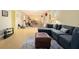Spacious basement with a sectional couch, workout equipment, and checkered flooring at 5020 Huntshire Sw Ln, Lilburn, GA 30047