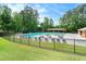 Community pool with ample seating and well-maintained grounds, perfect for summer relaxation and gatherings at 5020 Huntshire Sw Ln, Lilburn, GA 30047