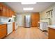 Well-equipped kitchen featuring stainless steel appliances, wood cabinets, and a white tile backsplash at 5020 Huntshire Sw Ln, Lilburn, GA 30047