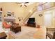 Spacious living room features a fireplace, hardwood floors, and a view of the second-floor landing at 5020 Huntshire Sw Ln, Lilburn, GA 30047