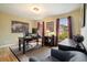 Comfortable home office with hardwood floors, natural light, and classic decor at 5020 Huntshire Sw Ln, Lilburn, GA 30047