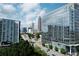 Stunning city view featuring modern high rise buildings and green trees under a sunny blue sky at 115 W Peachtree Nw Pl # 709, Atlanta, GA 30313